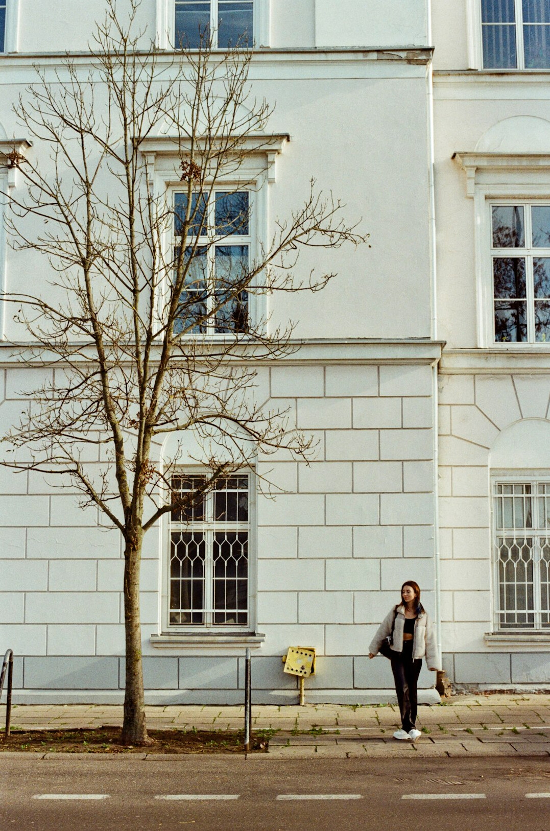 Portrait of an elderly Polish woman in front of her house