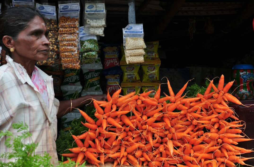 Market vendor selling vegetables at a local Polish market
